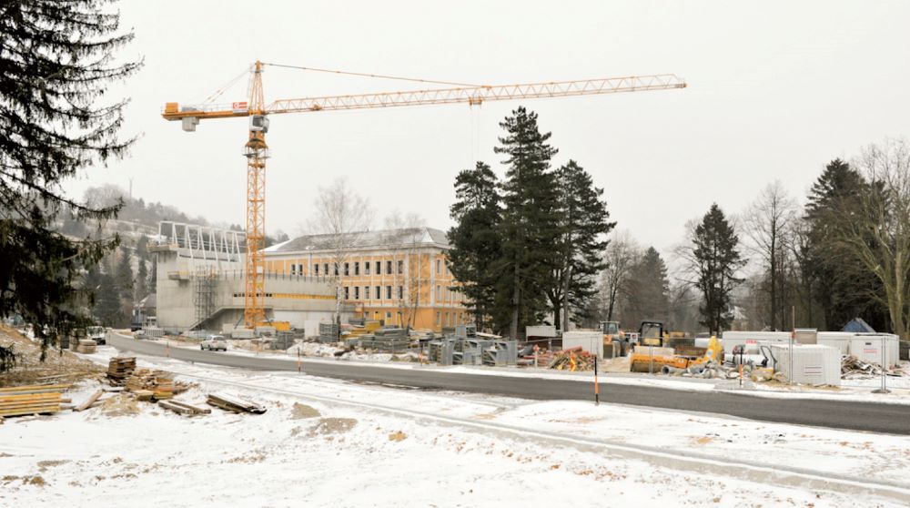 Construction site of a campus with a crane in winter