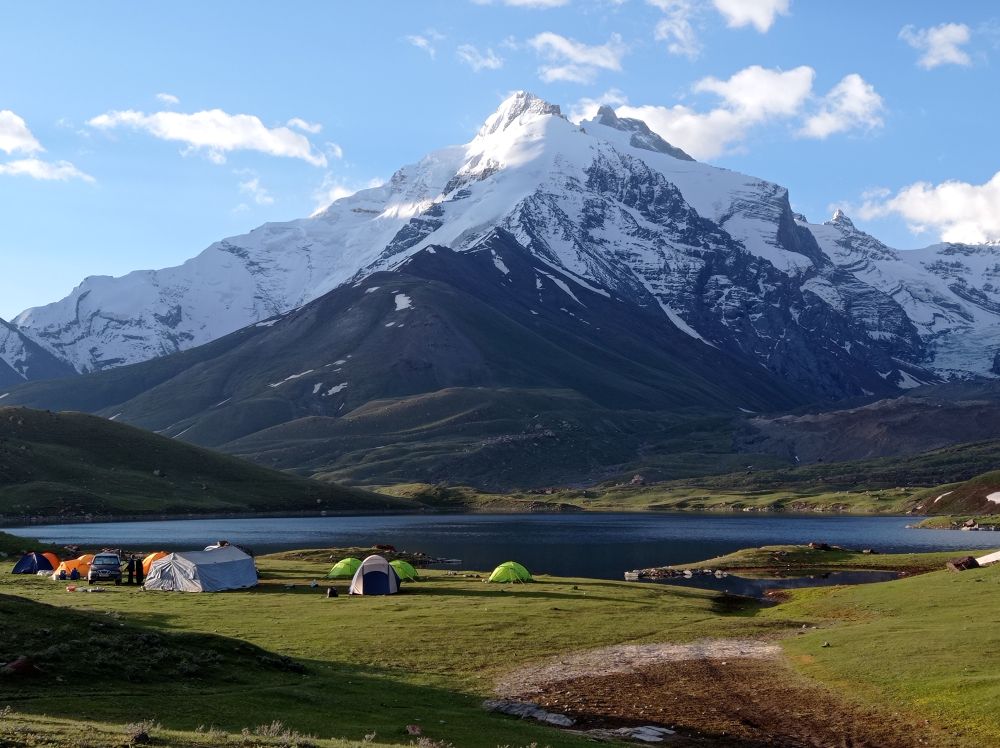 Researchers at a base camp north of Maidakul Lake, close to the Kyzylsu Glacier, during a field visit in June 2021. Northwestern Pamir Mountains, central Tajikistan.