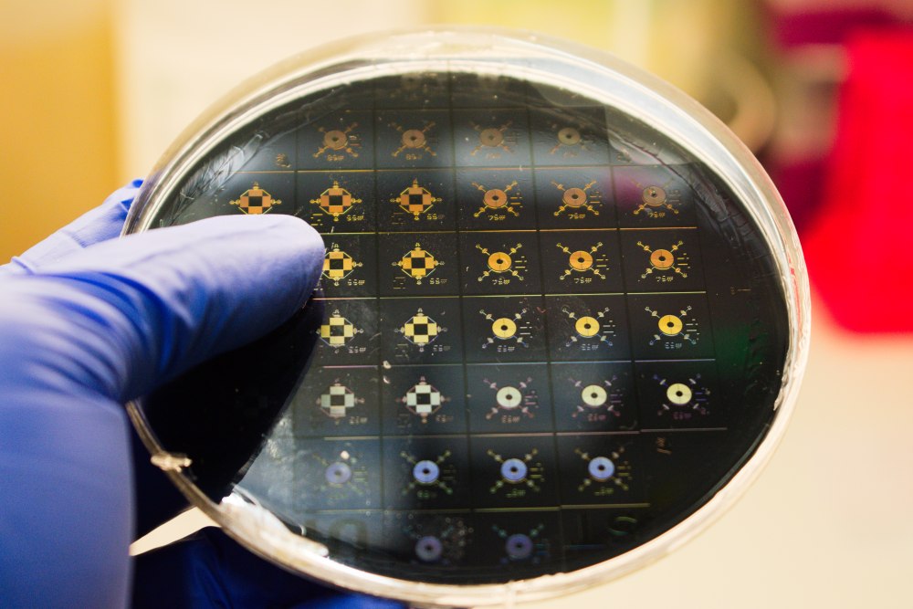 Specially designed microfluidic chips on a silicon wafer.