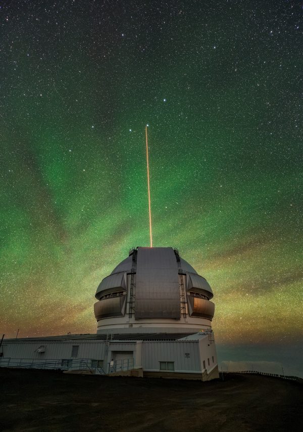 The Gemini North telescope’s laser guide star beams up into the atmosphere. 